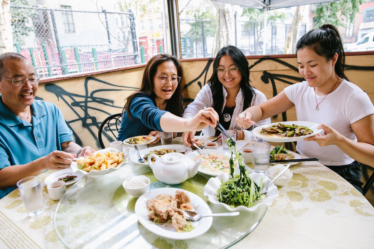 The Woks of Life family eating lunch in Chinatown