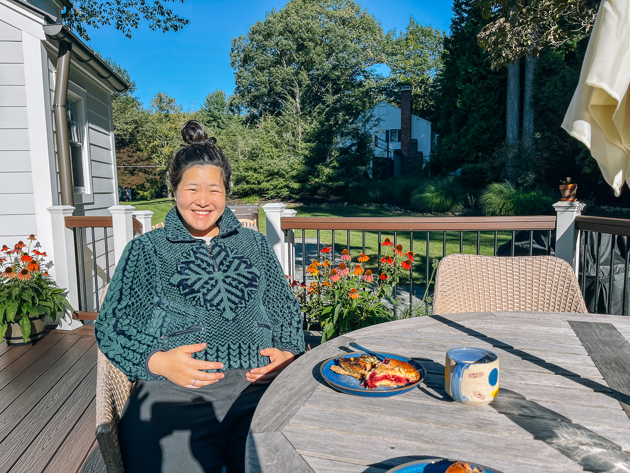 Sarah sitting outside on deck