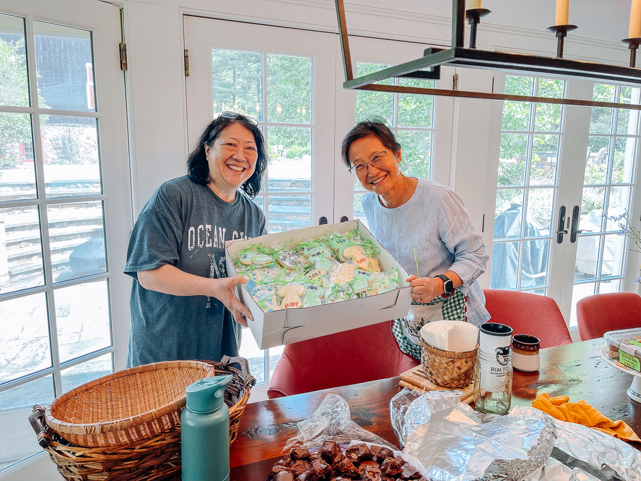 Sarah's aunt and Judy with baby shower sugar cookies