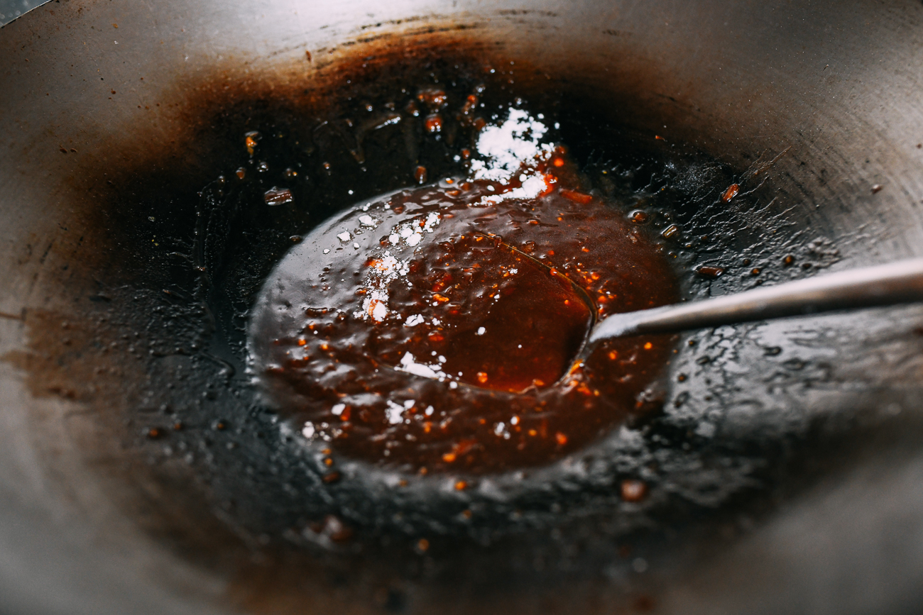 Stirring flour into char siu bao filling sauce to thicken