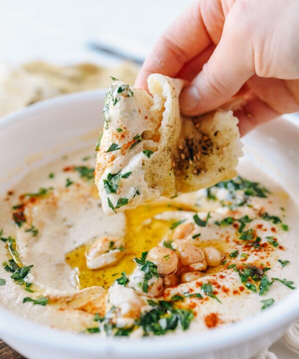 Dipping Laffa Bread into Hummus