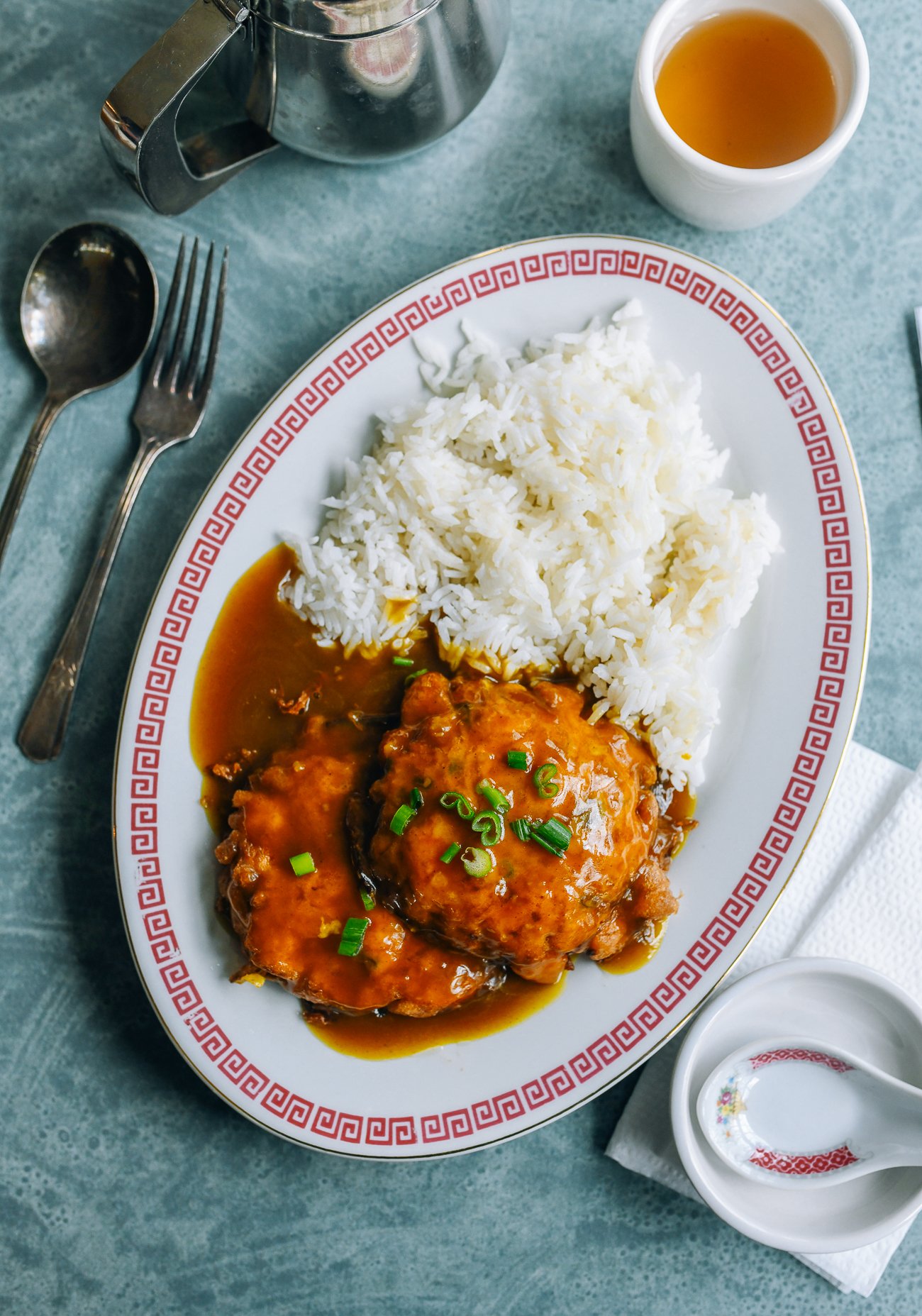 Shrimp Egg Foo Young on a plate with white rice