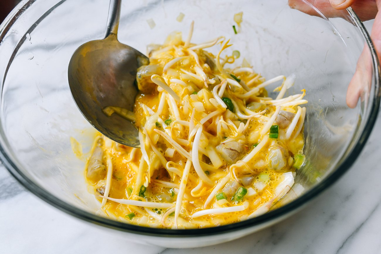 mixing egg foo young batter in mixing bowl