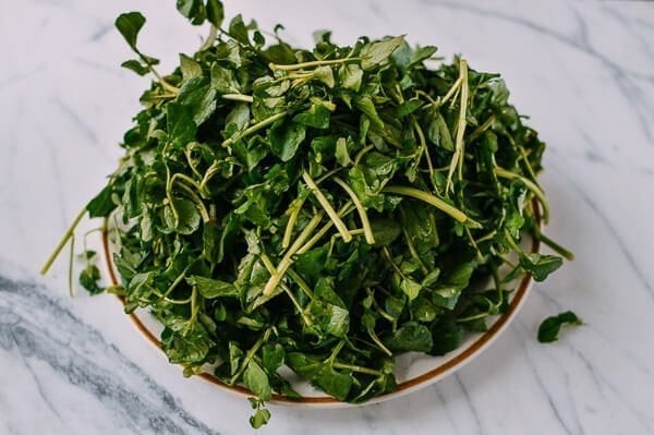 washed watercress on plate