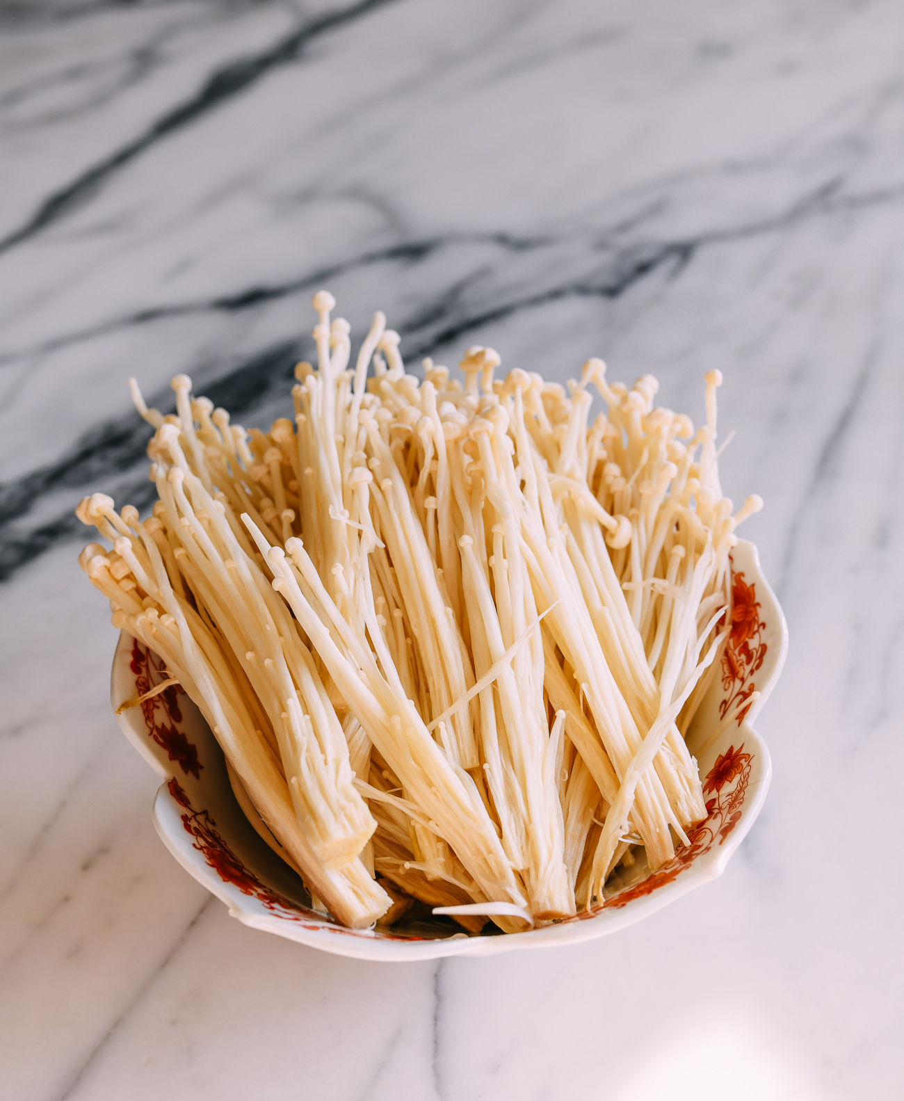 Enoki mushrooms in a bowl